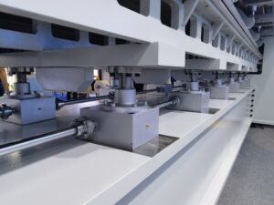 Screw jack lifting system for textile machinery frame adjustment